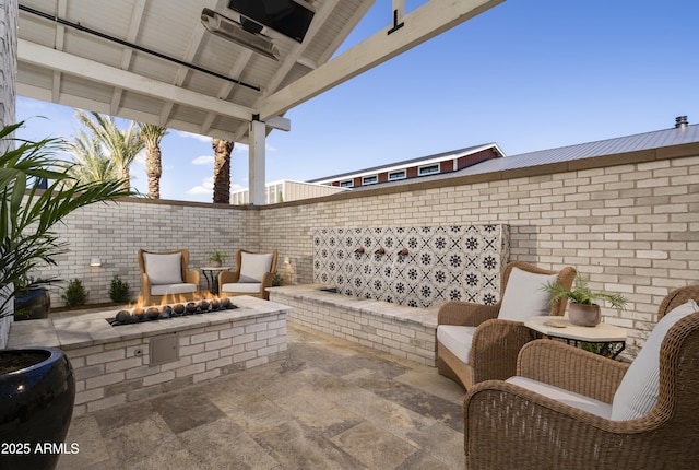 view of patio / terrace with a fire pit