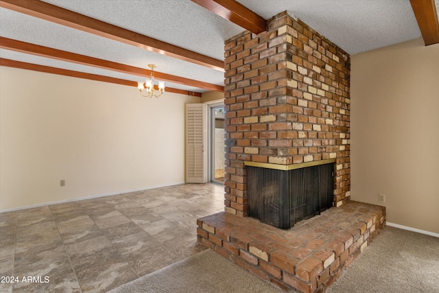 unfurnished living room with a textured ceiling, beamed ceiling, and a fireplace