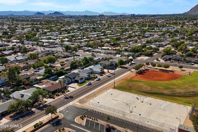 birds eye view of property with a mountain view