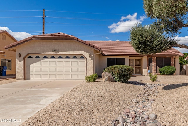 ranch-style home with a garage, a tile roof, driveway, and stucco siding