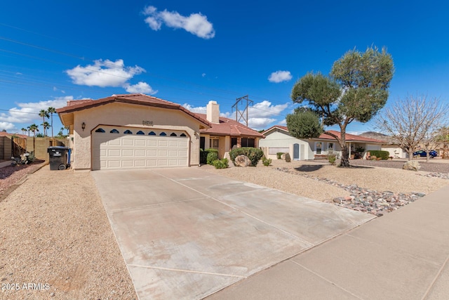 ranch-style home featuring a garage, driveway, a chimney, a tiled roof, and stucco siding