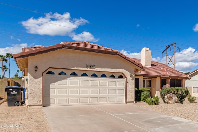 ranch-style house featuring driveway, a tiled roof, an attached garage, and stucco siding