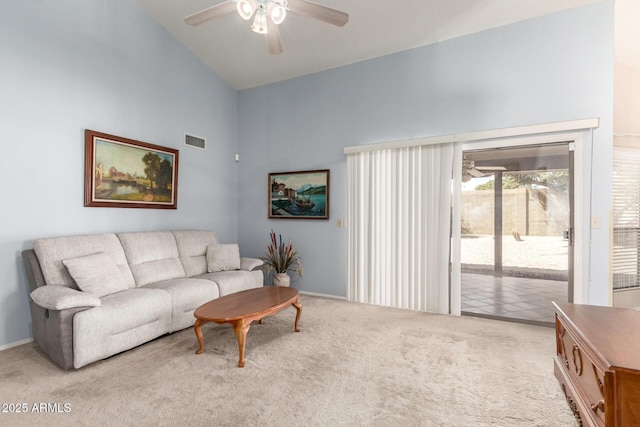 carpeted living area featuring high vaulted ceiling, visible vents, and a ceiling fan