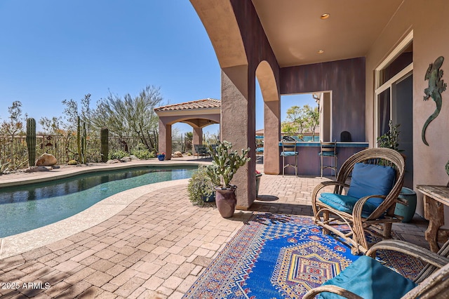 view of pool with fence, a fenced in pool, and a patio area