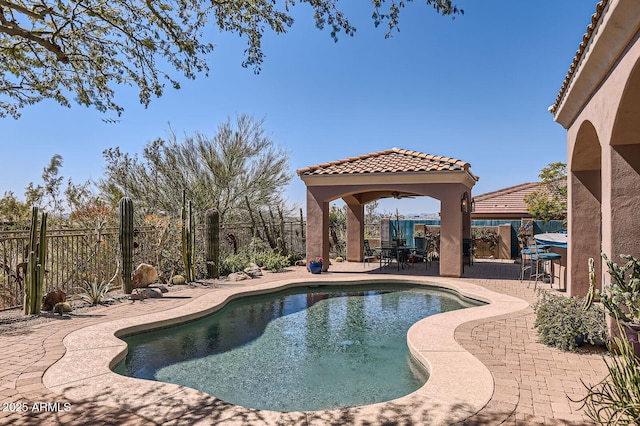 view of swimming pool featuring a patio, a fenced backyard, and a gazebo