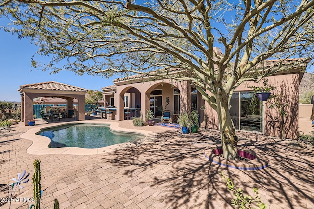 outdoor pool with a gazebo and a patio