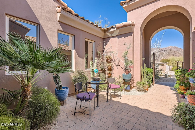 view of patio / terrace featuring a mountain view