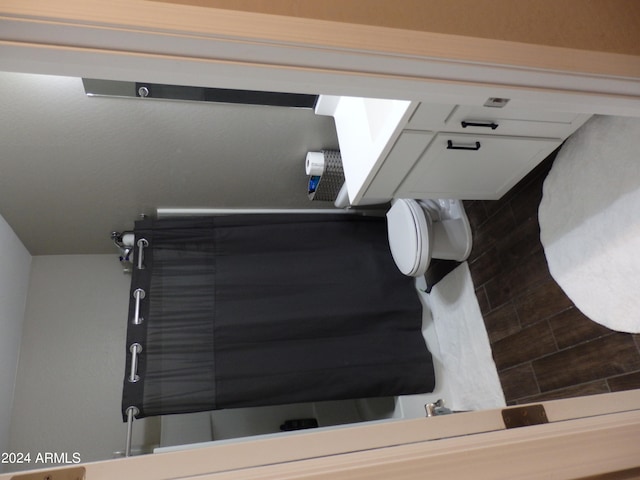 bathroom featuring toilet and a shower