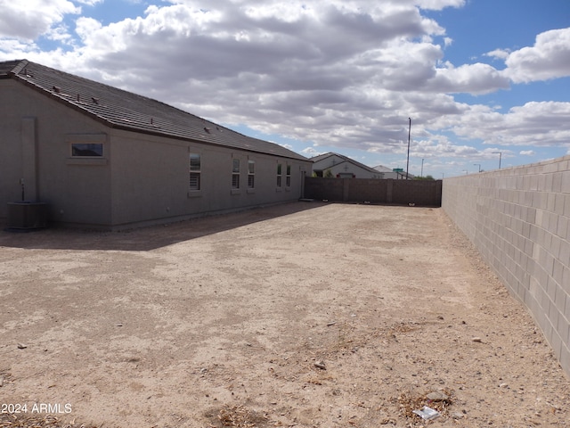 view of yard with central air condition unit