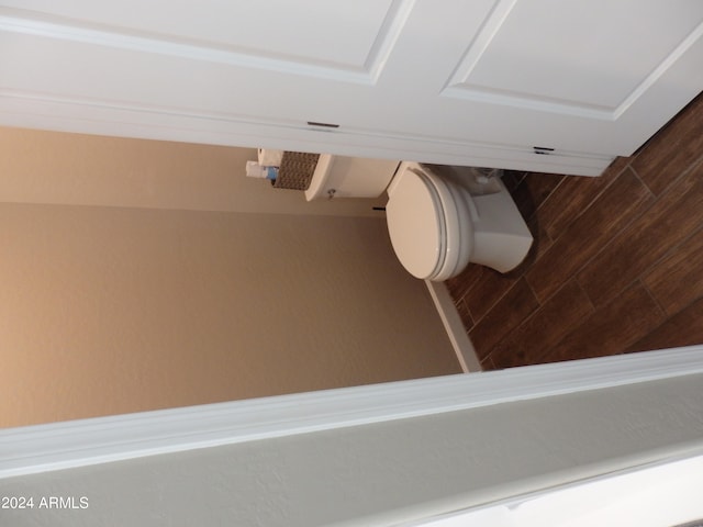 bathroom featuring toilet and hardwood / wood-style floors