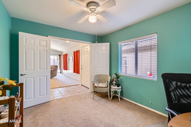 living area featuring ceiling fan and carpet floors