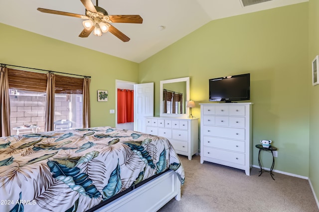 bedroom featuring ceiling fan, light carpet, and vaulted ceiling