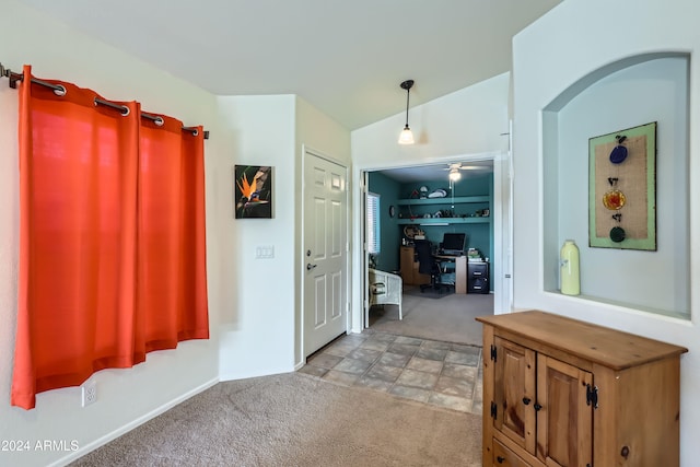 hallway featuring light colored carpet