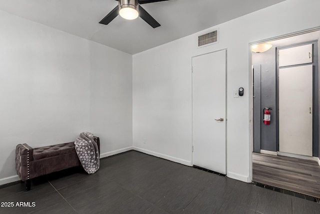 2941 N 19th Ave Unit 95, Phoenix, AZ 85015 - unfurnished room with a ceiling fan and baseboards