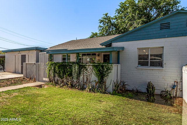 2941 N 19th Ave Unit 95, Phoenix, AZ 85015 - view of front facade with roof with shingles and a carport