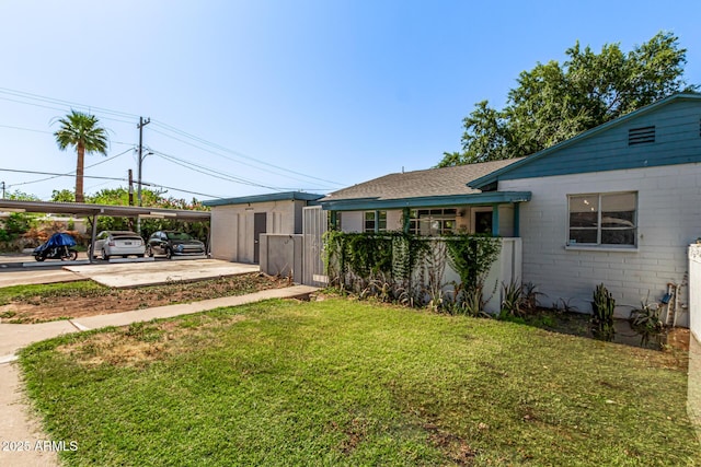 2941 N 19th Ave Unit 95, Phoenix, AZ 85015 - view of grassy yard with a carport