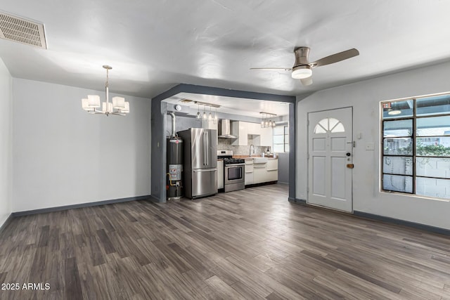 2941 N 19th Ave Unit 95, Phoenix, AZ 85015 - kitchen with stainless steel appliances, a chandelier, wall chimney range hood, and ceiling fan