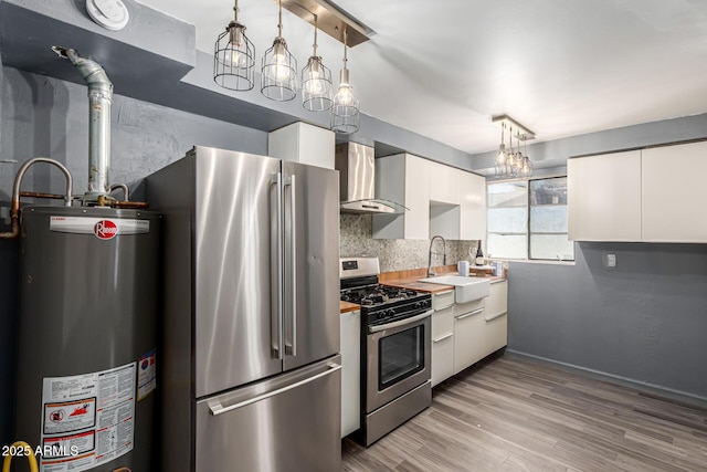 2941 N 19th Ave Unit 95, Phoenix, AZ 85015 - kitchen with stainless steel appliances, water heater, wall chimney range hood, white cabinets, and light wood finished floors