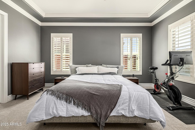 carpeted bedroom with baseboards and ornamental molding