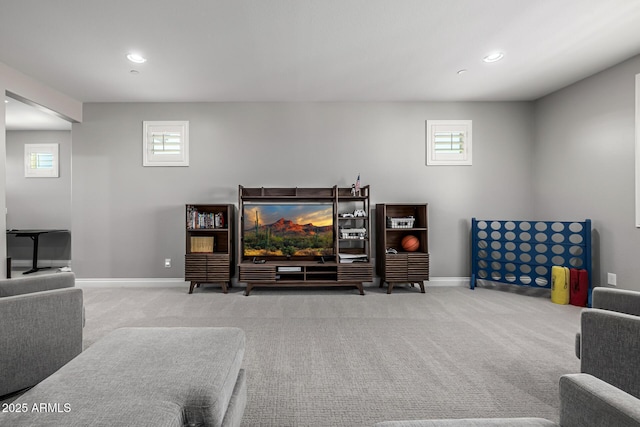 carpeted living room with recessed lighting and baseboards