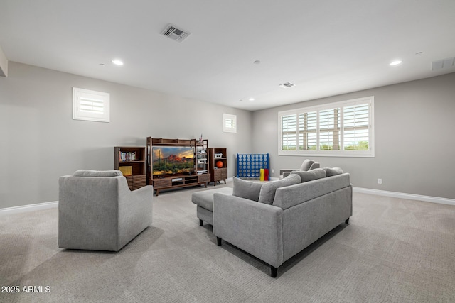 living room featuring recessed lighting, visible vents, light colored carpet, and baseboards