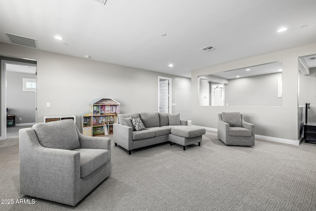 living area with recessed lighting, visible vents, carpet floors, and baseboards