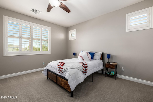 bedroom featuring visible vents, carpet flooring, baseboards, and ceiling fan