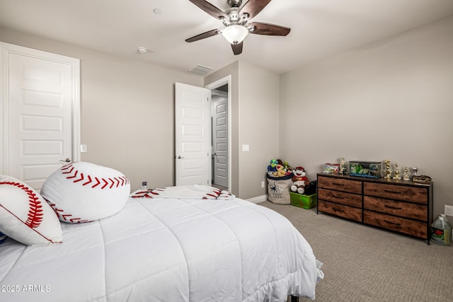 carpeted bedroom with a ceiling fan, visible vents, and baseboards