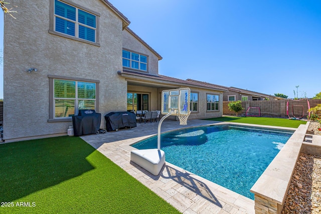 view of swimming pool with a lawn, a fenced backyard, a grill, a fenced in pool, and a patio area