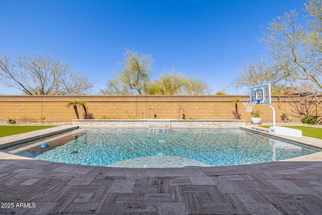 view of swimming pool with a fenced in pool, a patio, and a fenced backyard