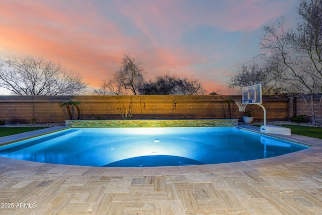 view of swimming pool with a patio, a fenced backyard, and a fenced in pool