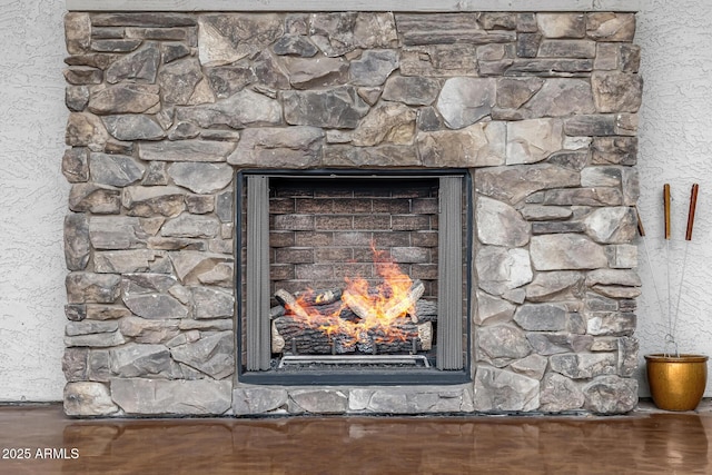 room details featuring a lit fireplace