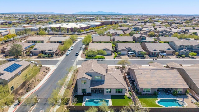 birds eye view of property with a residential view and a mountain view