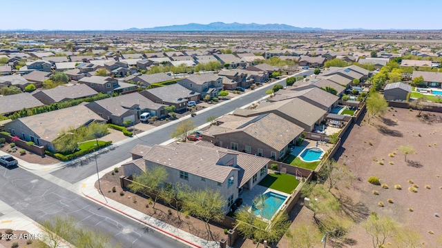 birds eye view of property featuring a mountain view and a residential view