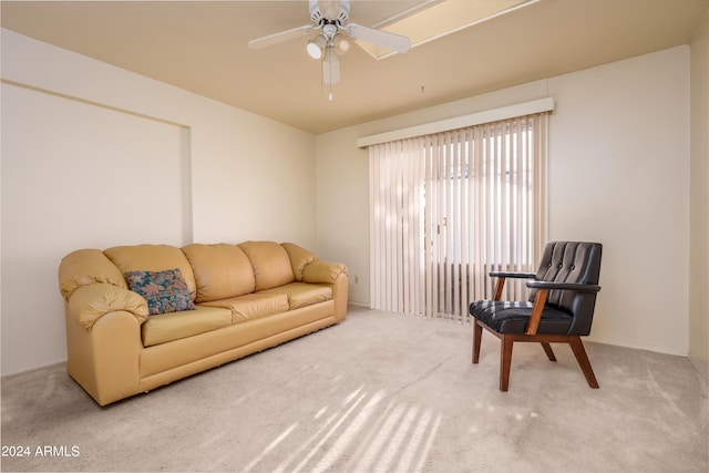 living room with carpet and ceiling fan