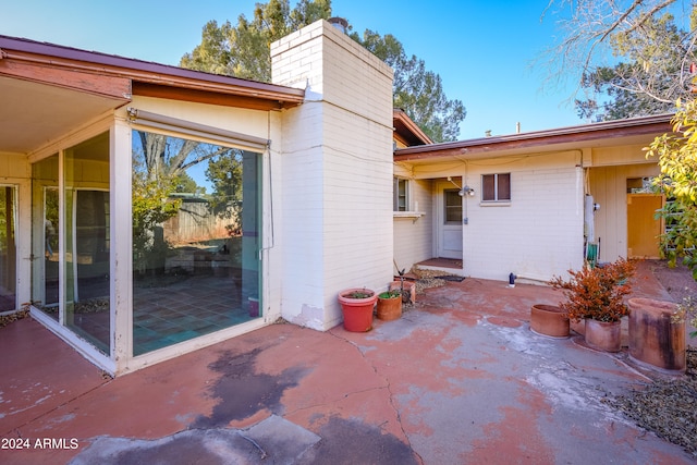 rear view of property featuring a patio