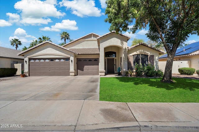 420 S Dodge Dr, Chandler, AZ 85225 - mediterranean / spanish house with an attached garage, driveway, a front yard, stucco siding, and a tiled roof