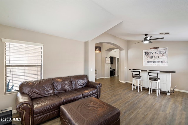 420 S Dodge Dr, Chandler, AZ 85225 - living room featuring arched walkways, ceiling fan, wood finished floors, and baseboards