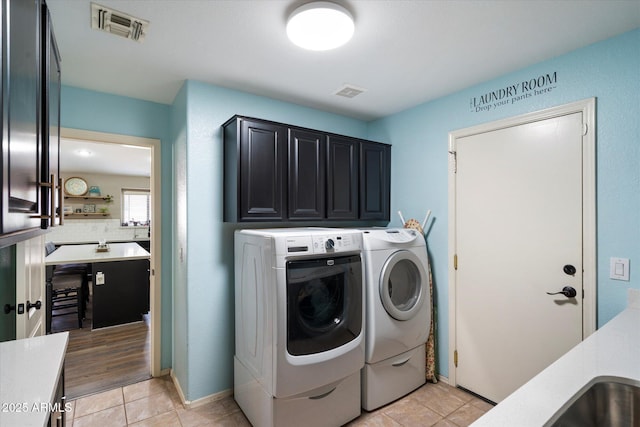 420 S Dodge Dr, Chandler, AZ 85225 - laundry room featuring cabinet space, washer and dryer, and light tile patterned flooring