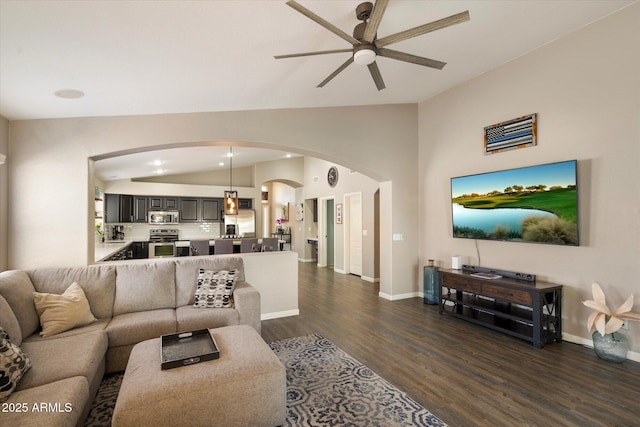 420 S Dodge Dr, Chandler, AZ 85225 - living room featuring lofted ceiling, arched walkways, a ceiling fan, dark wood-style floors, and baseboards