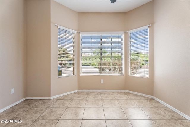40614 N Key Ln, Anthem, AZ 85086 - tiled spare room with baseboards and ceiling fan