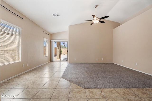 40614 N Key Ln, Anthem, AZ 85086 - unfurnished room featuring a ceiling fan, lofted ceiling, light tile patterned floors, and light colored carpet