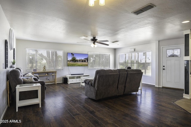 14484 W Jimmie Kerr Blvd, Casa Grande, AZ 85122 - living area featuring plenty of natural light, a textured ceiling, a ceiling fan, wood finished floors, and baseboards