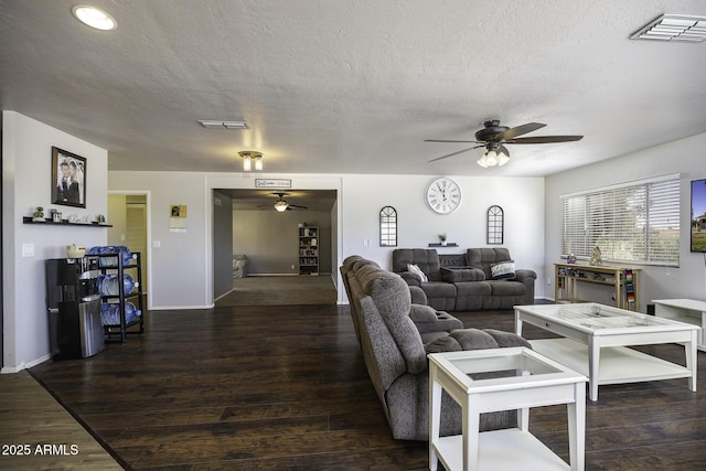 14484 W Jimmie Kerr Blvd, Casa Grande, AZ 85122 - living room with ceiling fan, a textured ceiling, wood finished floors, and baseboards