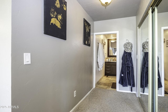 14484 W Jimmie Kerr Blvd, Casa Grande, AZ 85122 - hallway featuring baseboards and light carpet