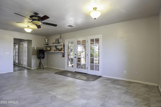 14484 W Jimmie Kerr Blvd, Casa Grande, AZ 85122 - spare room featuring french doors, baseboards, and ceiling fan