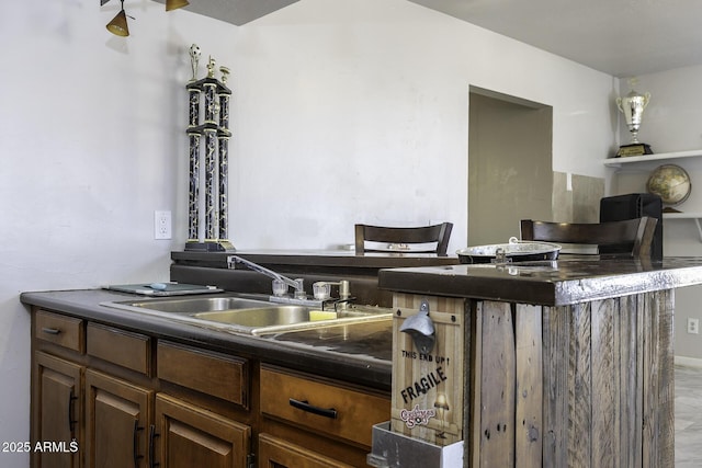 14484 W Jimmie Kerr Blvd, Casa Grande, AZ 85122 - kitchen featuring dark countertops and a sink