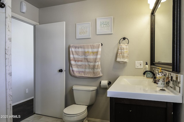 14484 W Jimmie Kerr Blvd, Casa Grande, AZ 85122 - bathroom featuring toilet, vanity, marble finish floors, and baseboards