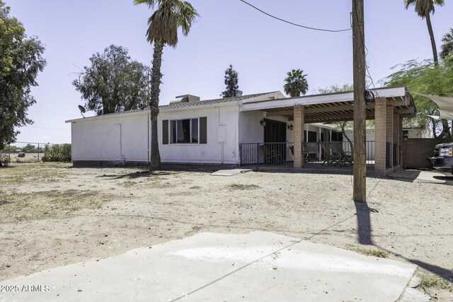 14484 W Jimmie Kerr Blvd, Casa Grande, AZ 85122 - back of house with fence and a carport