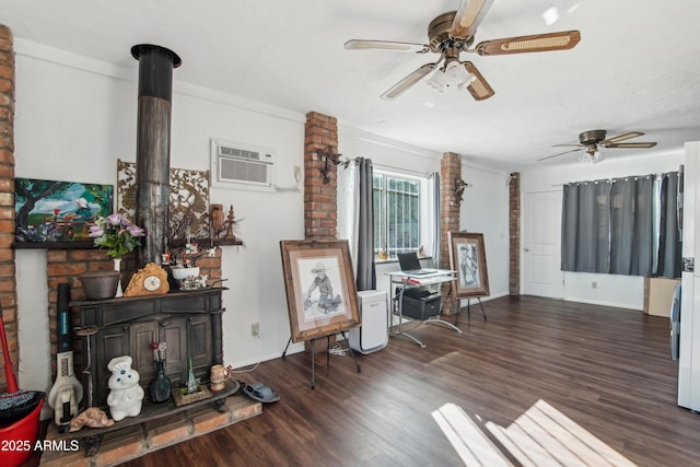 living room featuring a wall mounted air conditioner, dark wood-type flooring, and ceiling fan